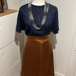 Rust colored satin skirt. Size 4-6.